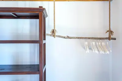 a wooden shelf with a rope hanging from a wall at Mediterranean Gem Getaway in Valencia