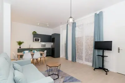 a living room with a couch and a table at GuestReady - Valencia's Vibrant Malvarrosa in Valencia