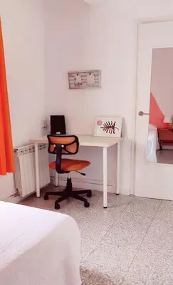 a bedroom with a desk with a chair and a computer at Casa Lola - Con 2 terrazas, ideal para desconectar in Requena