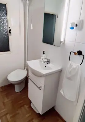 a white bathroom with a toilet and a sink at Casa Lola - Con 2 terrazas, ideal para desconectar in Requena