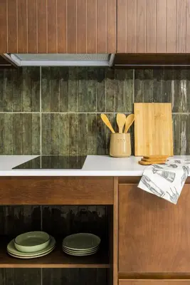 a kitchen with a counter with plates and wooden cabinets at Green suite by Concept Flats in Valencia