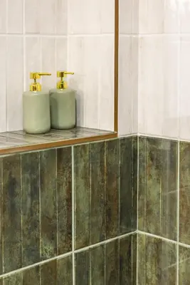 a bathroom with two soap dispensers on a shelf at Green suite by Concept Flats in Valencia