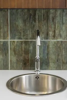 a stainless steel sink with a faucet at Green suite by Concept Flats in Valencia