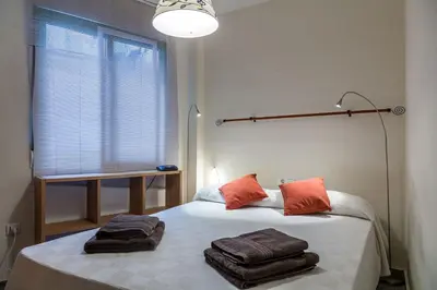 a bedroom with a bed with towels on it at Valencia Flat Rental Patacona Beach in Valencia