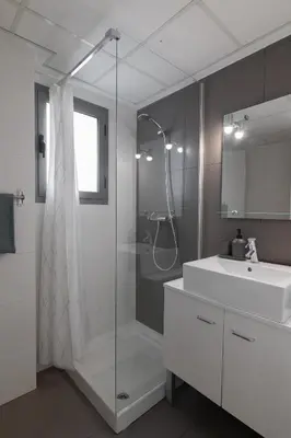 a bathroom with a glass shower and a sink at DormForYou Jose Maria Haro in Valencia