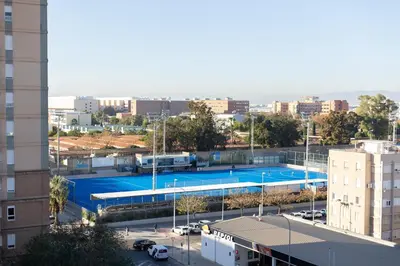a view of a tennis court in a city at DormForYou Jose Maria Haro in Valencia
