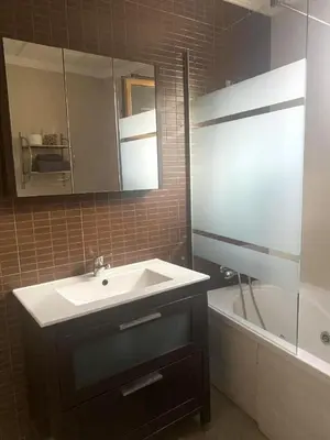 a bathroom with a sink and a mirror and a tub at Ca' La Conchin in Cortez de Pallas
