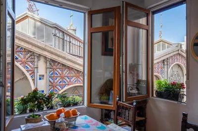 a window with a view of the eiffel tower at Mirador 1 del Mercado Central - habitacion con baño privado en el centro de la Ciudad Vella in Valencia