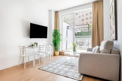 a living room with a couch and a table at SOROLLA APARTMENTS CENTRAL Station in Valencia