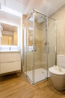 a bathroom with a shower and a toilet and a sink at SOROLLA APARTMENTS CENTRAL Station in Valencia
