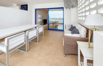a living room with a table and a couch at 2 Bedroom Awesome Apartment In Moncofa in Moncófar