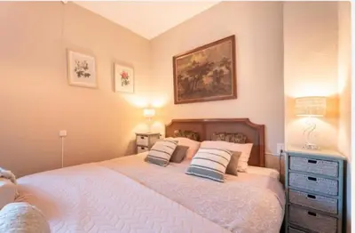 a bedroom with a large bed with two pillows at Ensueño Alojamiento Turístico in Alcublas