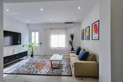 a living room with a couch and a table at Arenas flat in Valencia