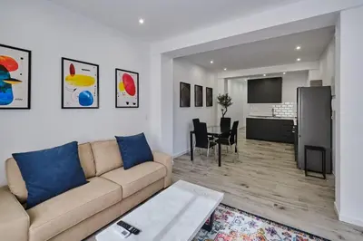 a living room with a couch and a dining room at Arenas flat in Valencia