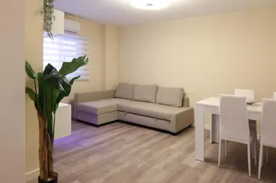 a living room with a couch and a table at Non Stress Nuevo Turia in Valencia