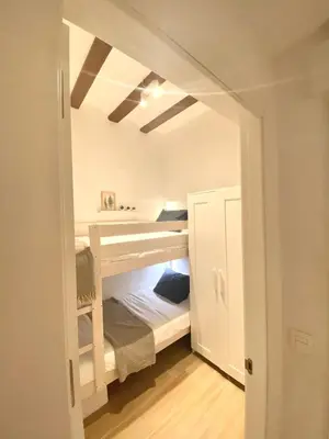 a room with a bunk bed in it at Cabanyal Sunny Beach House in Valencia