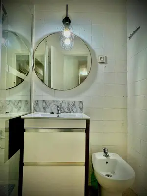 a bathroom with a sink and a mirror at Habitación en la playa in Valencia