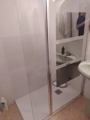 a bathroom with a shower and a sink at Habitación en la playa in Valencia