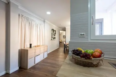 a kitchen with a basket of fruit on the floor at Nice lodging near the Plaza de Toros in Valencia