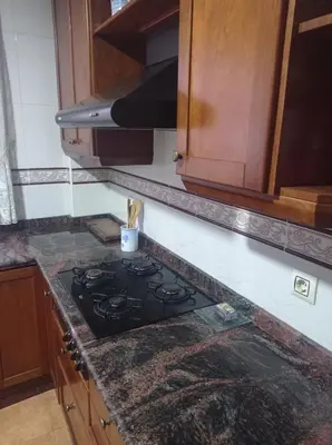 a kitchen with a stove top oven in a kitchen at CA ÁNGEL in Anna