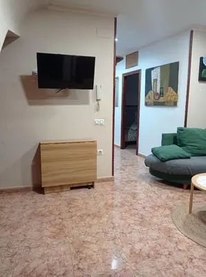 a living room with a couch and a flat screen tv at CA ÁNGEL in Anna