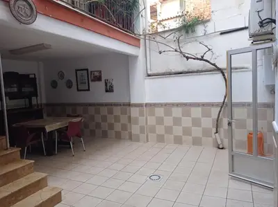 a room with a table and a table and a window at CA ÁNGEL in Anna