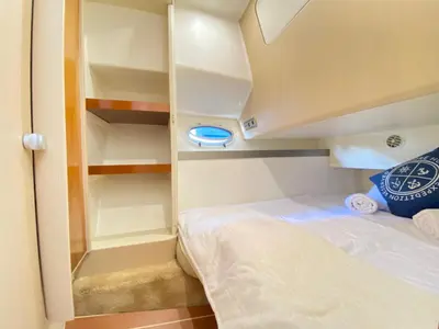 a small bed in the corner of a small room at The Valencia Yacht Experience in Valencia