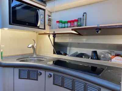 an interior view of a kitchen in a caravan at The Valencia Yacht Experience in Valencia