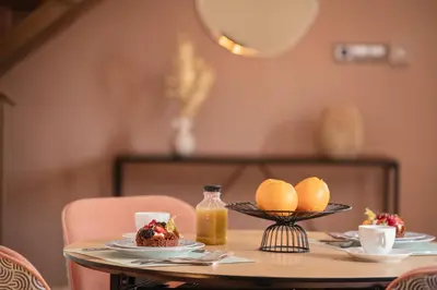 a table with a plate of food and oranges on it at Cozy Up Spain in Valencia