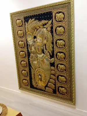 a painting of a goddess in a gold frame on a wall at El rinconet in Partida de La Cañada