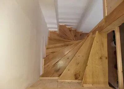 a wooden stairwell in a house with wooden floors at APARTAMENTO MARÍTIMO in Valencia