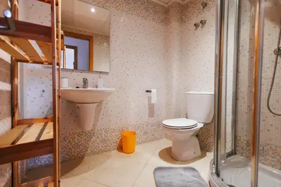 a bathroom with a toilet and a sink and a shower at Lujoso apartamento de dos habitaciones en la playa de Canet in Canet de Berenguer