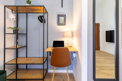 an office with a desk with a chair and a laptop at Travel Habitat Patraix Suite con Terracita in Valencia
