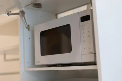 a white microwave oven in a kitchen at NEW BEACH flats VALENCIA in Valencia