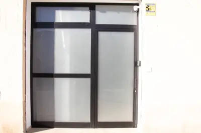 a glass door with a black and white window at Congresos Flat by Concept Flats in Valencia