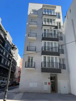 a tall building with balconies on the side of it at Imperial Apartamentos Valencia in Valencia