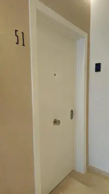 a door in a room with the number on the wall at Imperial Apartamentos Valencia in Valencia