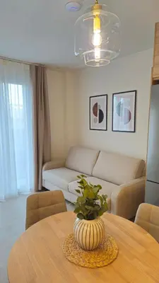 a living room with a table and a couch at Imperial Apartamentos Valencia in Valencia
