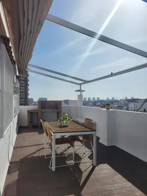 a patio with a table and chairs on a balcony at SingularStays Valero III in Valencia