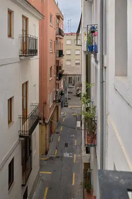 an empty street in an alley between buildings at Apartamento soleado en plaza del Carmen in Valencia