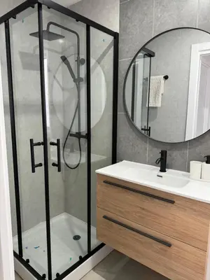 a bathroom with a shower and a sink and a mirror at UIM Mediterraneo Cendoya 2 Wifi in Puerto de Sagunto