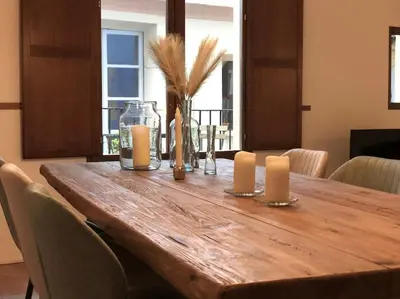 a wooden table with two candles and two candles at Loft con estilo y terraza en centro histórico in Valencia