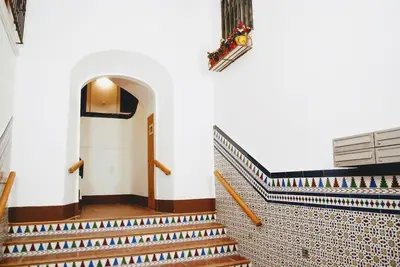 a set of stairs in a building with tiles at Loft con estilo y terraza en centro histórico in Valencia