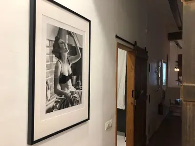 a black and white picture of a woman on a wall at Loft con estilo y terraza en centro histórico in Valencia