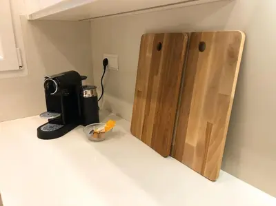 a kitchen counter with a coffeemaker and a coffee maker at Loft con estilo y terraza en centro histórico in Valencia