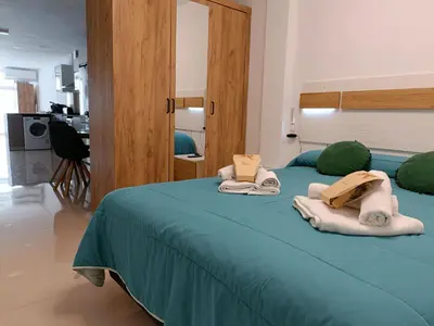 a bedroom with two beds with towels on them at Precioso Loft Sorolla en Playa Malvarrosa/Patacona in Valencia