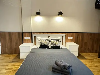 a bedroom with a large bed with two night stands at Lliri 7 in Valencia
