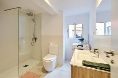 a bathroom with a toilet and a sink and a shower at REINA FLAT in Valencia