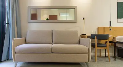 a living room with a couch and a table at Osito Hub - Duque de Gaeta in Valencia