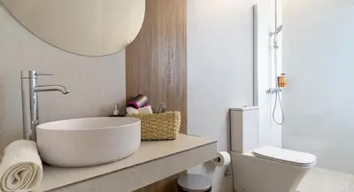 a bathroom with a sink and a toilet and a mirror at Osito Hub - Duque de Gaeta in Valencia